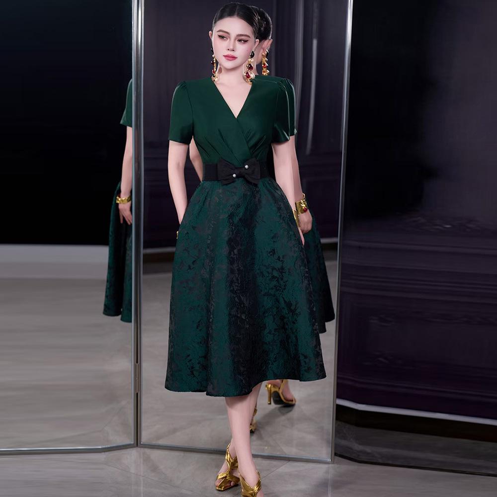 French Spring/Summer 2026 Women's V-Neck Black Bow Tie Jacquard Dress with Waist-Cinching and Wide Hem.
