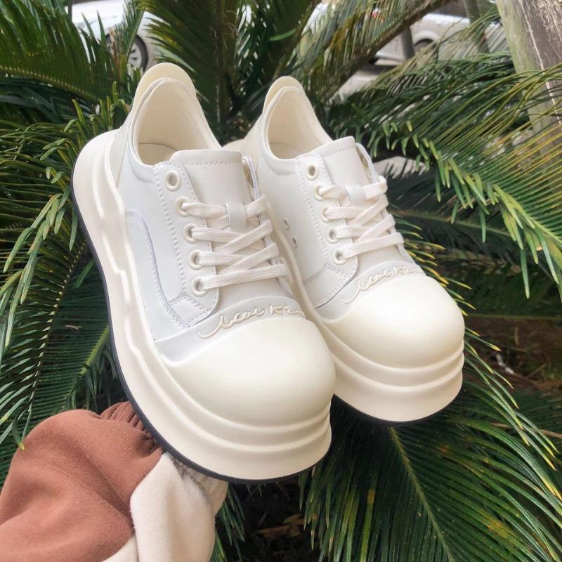 

Ugly cute height increase Mickey black and white big head shoes women s new leather versatile casual sports platform bread shoes tide 40