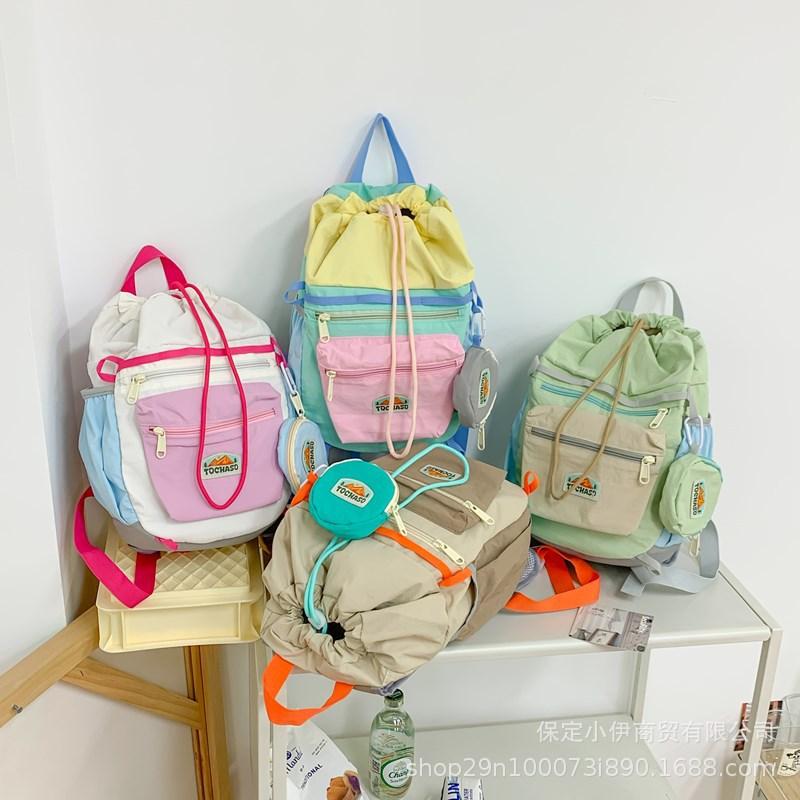 Schoolbag Korean contrasting color Macaron backpack 1011 new lightweight and cute kindergarten schoolbag drawstring backpack wholesale