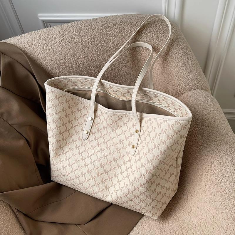 Die Tasche ist eine High-End-, exquisite, Nischen-, großvolumige Tasche, vielseitige große Pendlertasche, mit Textur für Damen, tragbare Tote Bag.