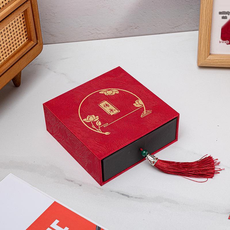 

Tassel Heritage Jewelry Storage Box with Gold Silver Ornament Design