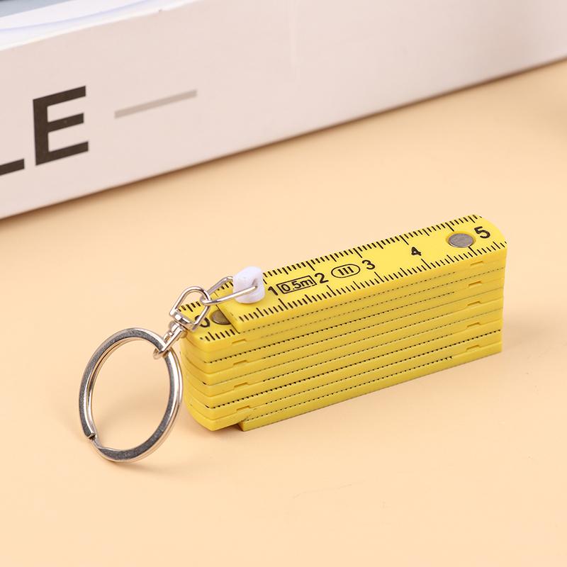 1 Stück 0,5 Meter 10-fach Schlüsselanhänger Kunststoff Hochpräzisions-Faltmaßstab Kann für Reisen, Holzbearbeitung, Maurerarbeiten, Heimwerken aufbewahrt werden