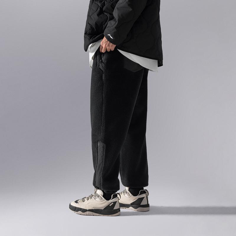 Li Ning CF Suo Jednokolorowe Polarowe Ciepłe Spodnie Casualowe ze Ściągaczami Męskie Spodnie Czarne AKLU901-4