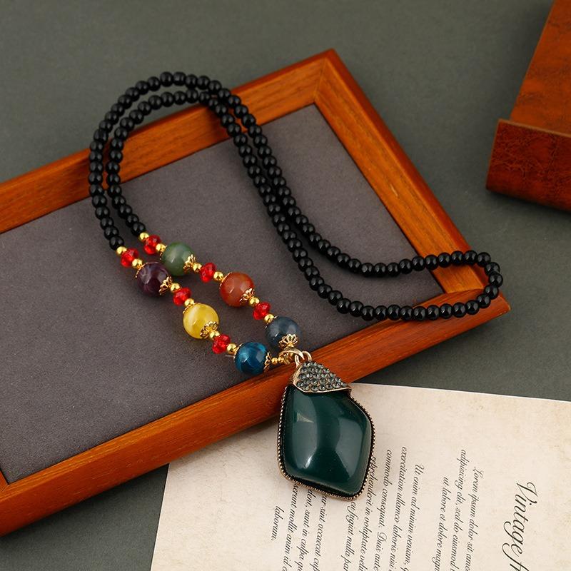 

Retro long necklace, water drop beeswax pendant, women s versatile high-end temperament sweater chain pendant with accessories