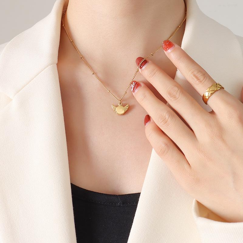 Gold-Plated Geometric Wing Pendant Necklace: Japanese-Korean Design with Titanium Steel Clavicle Chain