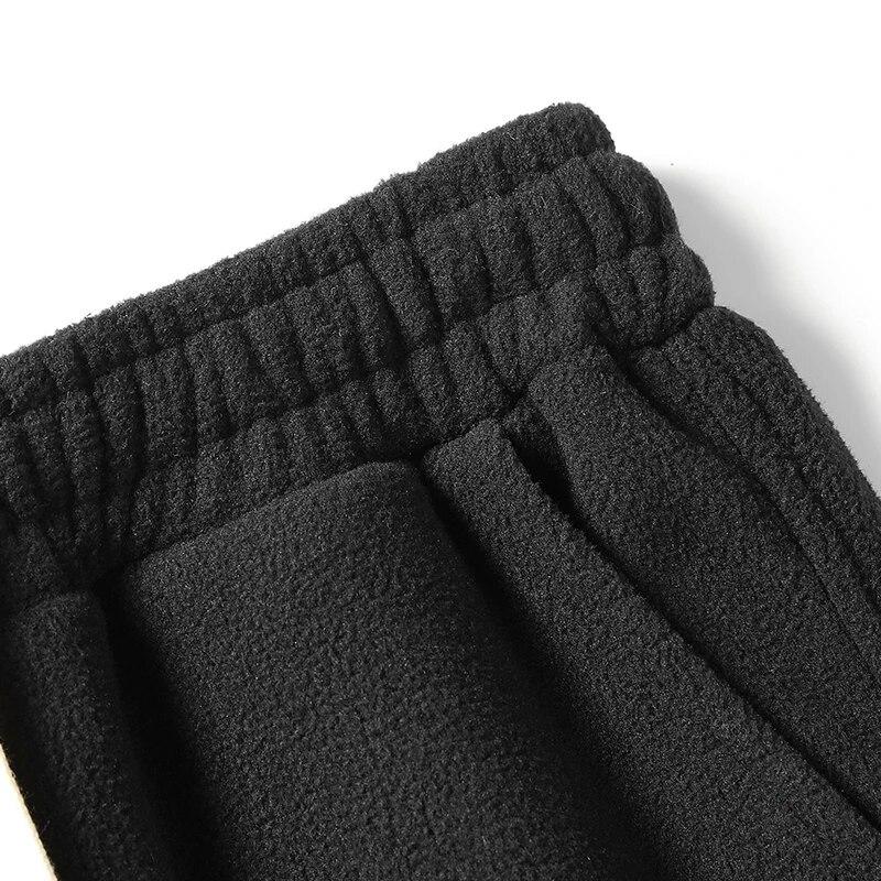 Зимние теплые утепленные спортивные штаны — фото 9