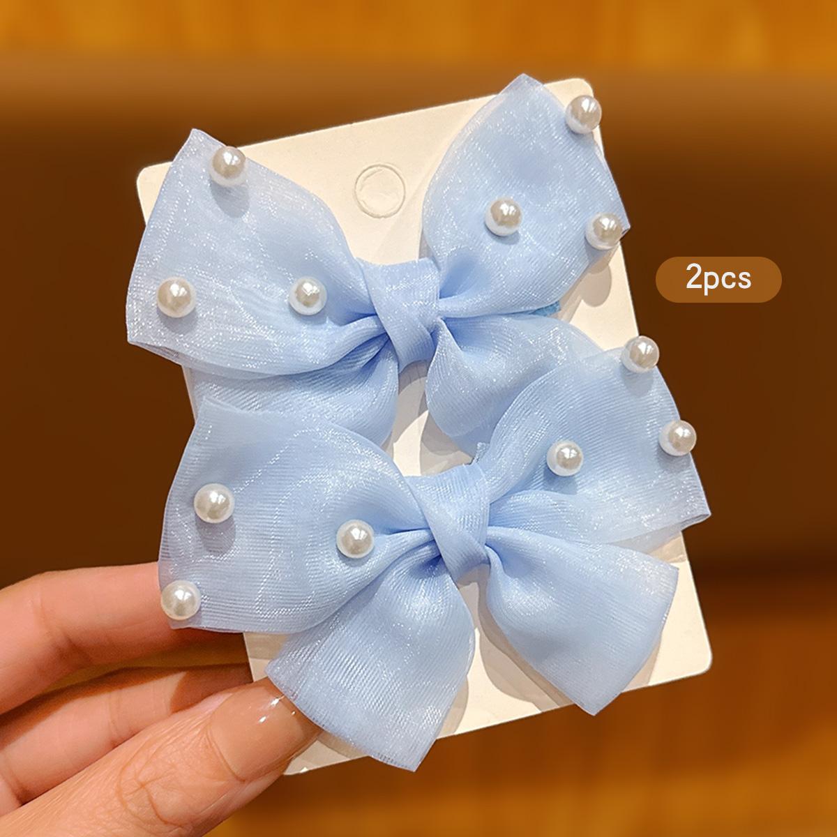 

2 blue bow hair clips and hair accessories suitable for daily use
