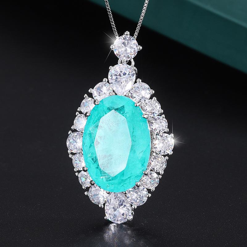 

Ювелирные изделия Медное основание Золотое покрытие Имитация Изумруда Параиба Подвеска Ожерелье Большой Дэн 18 * 25