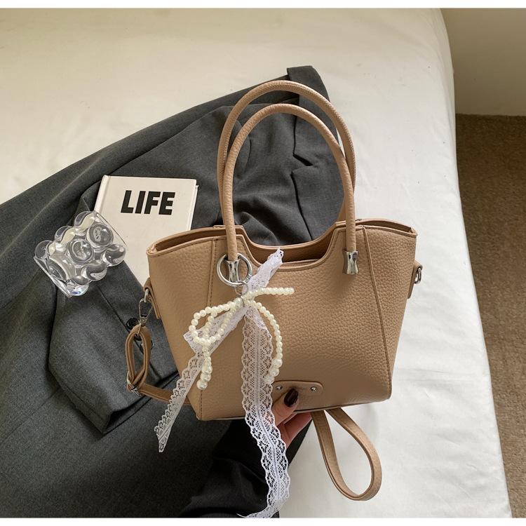 

Корейская версия трендовой ручной сумки-ведра, женская летняя 2025, новая простая модная универсальная сумка через плечо, нишевая, с высоким чувством стиля