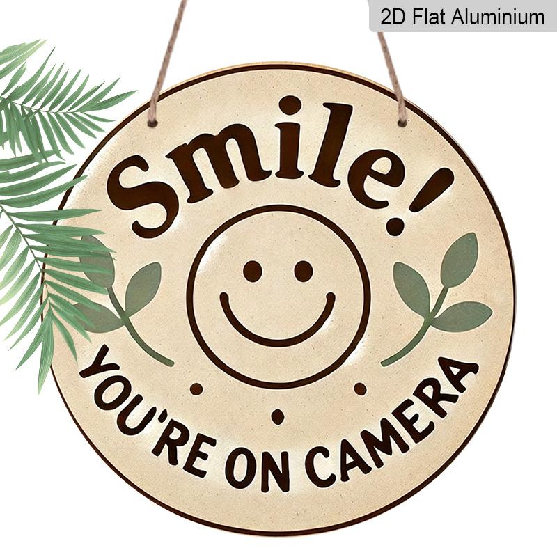 

2D Flat, 1pc Round Aluminum Hanging Sign, Smile You re On Camera Cute Smiley Face & Leaf Design, Retro Warm Security Warning Metal Sign, Perfect 7.87*7.87inch