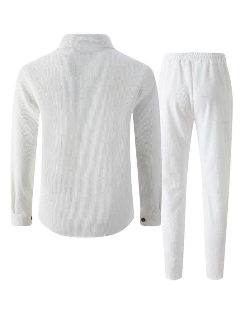 Completo casual da uomo autunnale europeo con giacca a maniche lunghe a nido d'ape e pantaloni