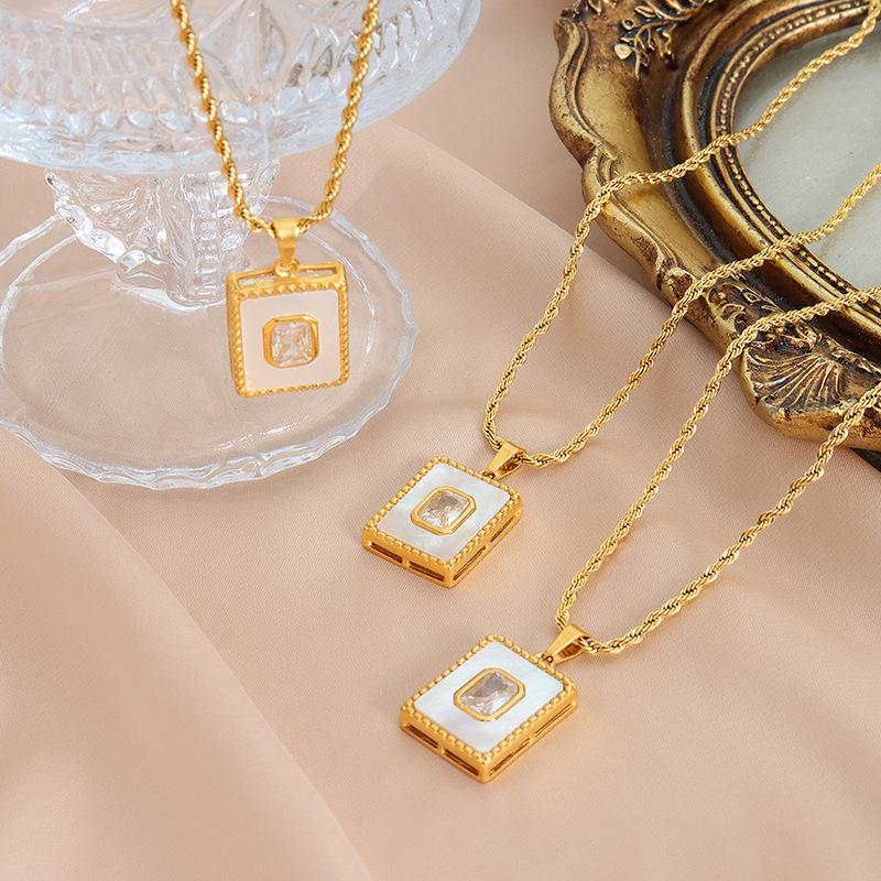 Elegant White Mother-of-Pearl Pendant Necklace - European and American Design, Versatile Titanium Steel Clavicle Chain for Women.