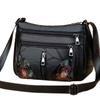 The lady's crossbody bag is made of PU and features printed patterns, perfect for traveling and shopping.