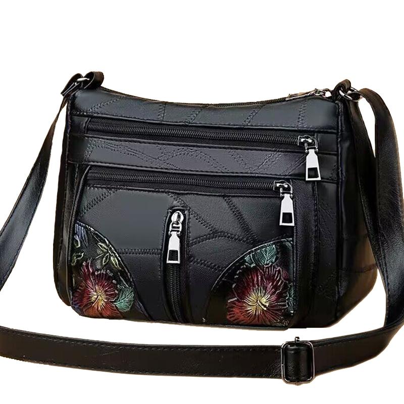 The lady's crossbody bag is made of PU and features printed patterns, perfect for traveling and shopping.