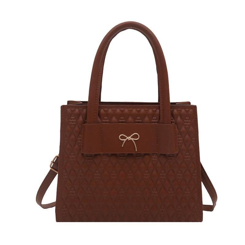 

The new one-shoulder cross-body shaped small square bag is a fashionable casual texture indentation simple handbag