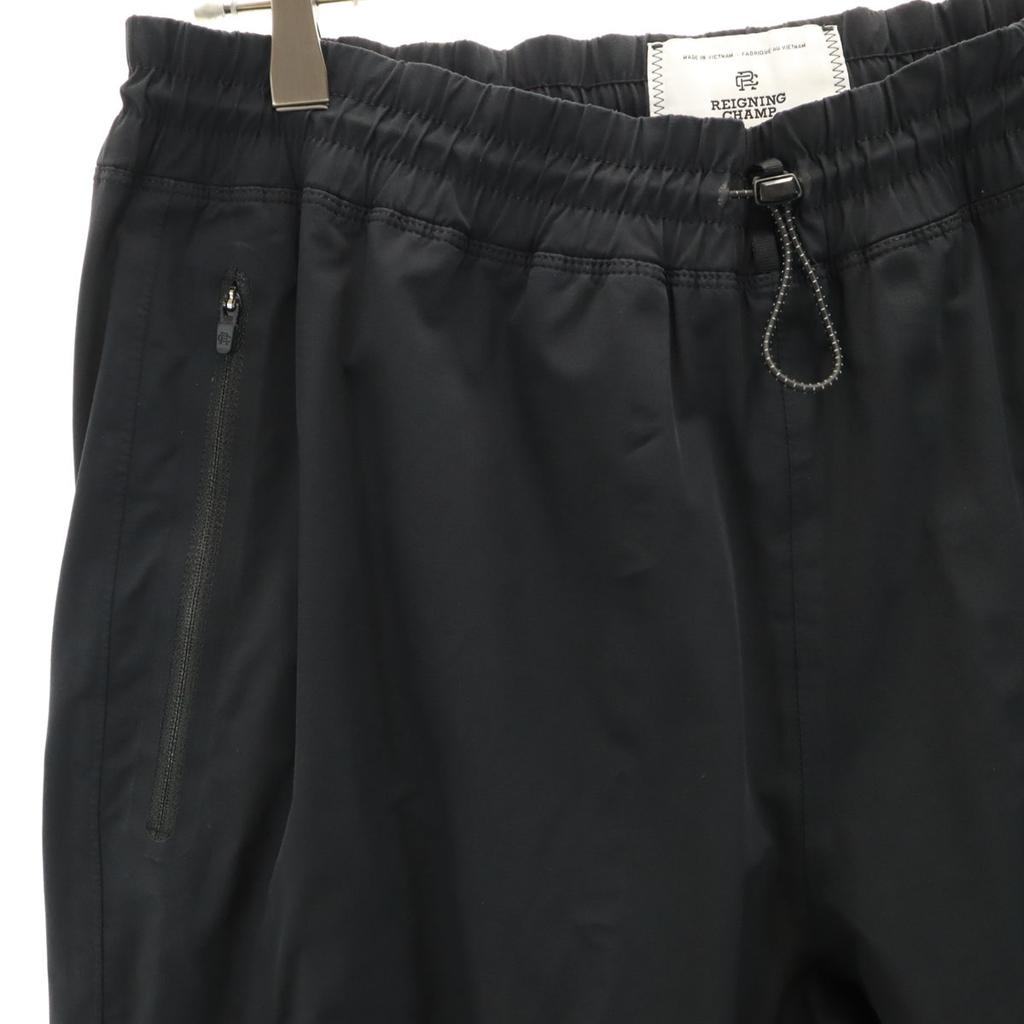 REIGNING CHAMP Spodnie wiatrówki L czarne Męskie Używane