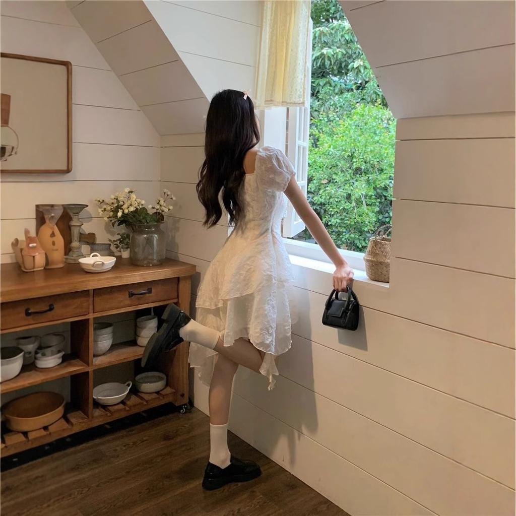 Coffee break French first love white irregular dress women's 2026 summer super fairy seaside vacation princess dress small man
