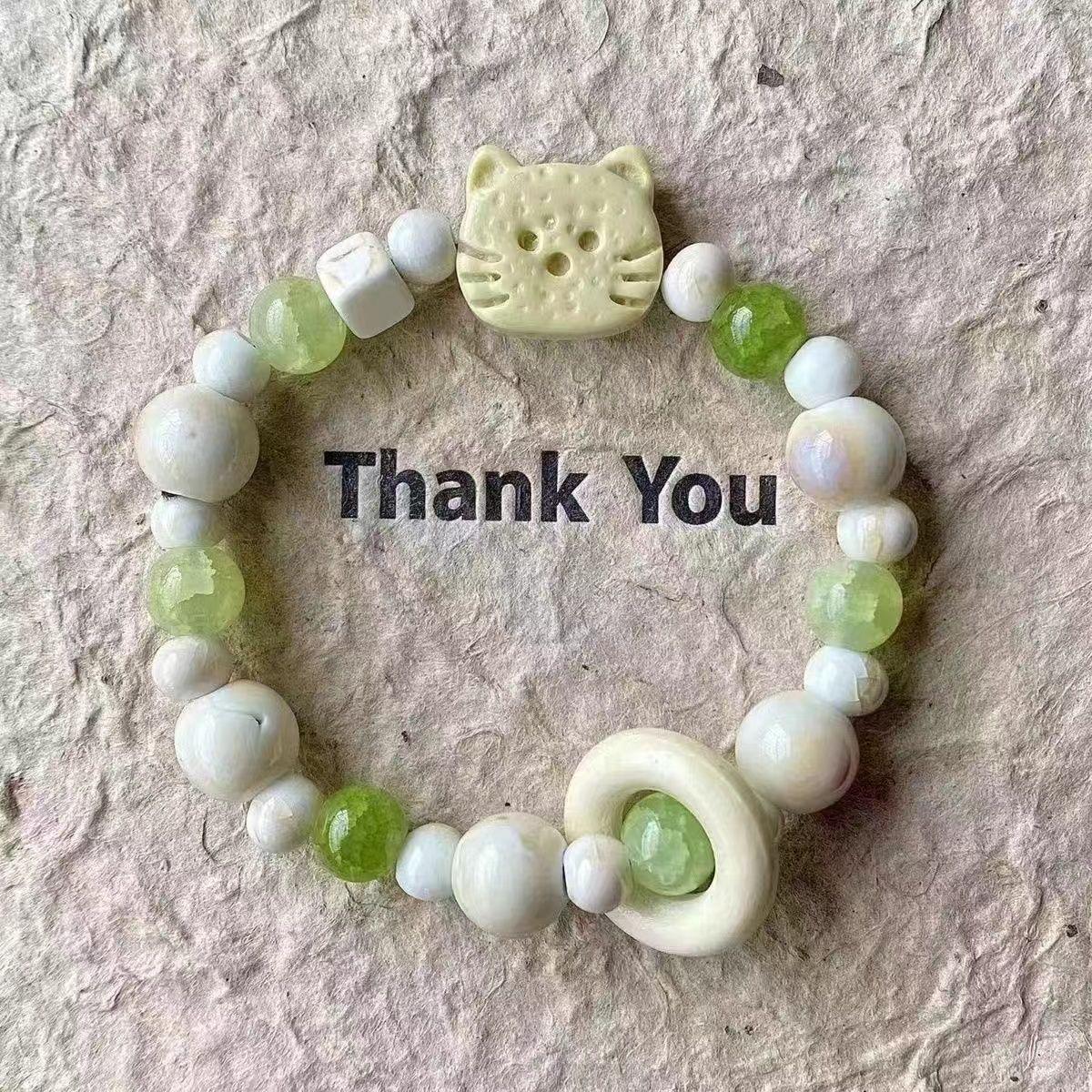 

Green Bead Yellow Face Bracelet one size