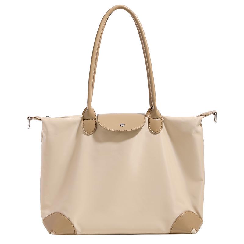 Simple Casual Women's Dumpling Handbag: High-End, Large Capacity, Crossbody & Commute Bag