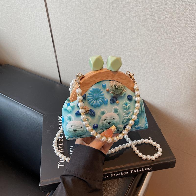 

Shell bag women s summer new women s high-end messenger bag retro literary niche pearl shoulder bag синій