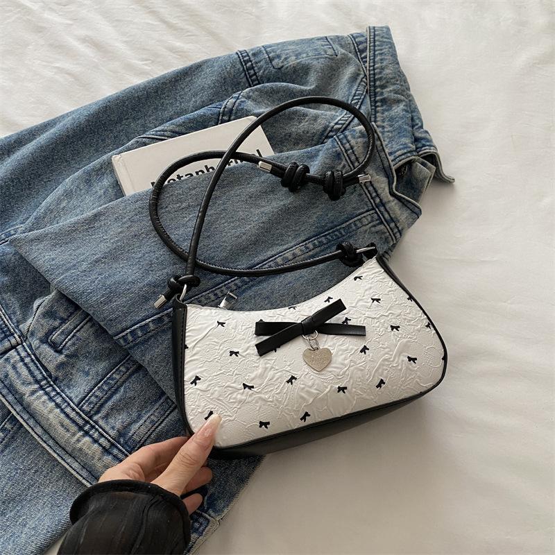 Niche design bow underarm bag women's 2025 new handbag fashion shoulder messenger bag sweet baguette bag