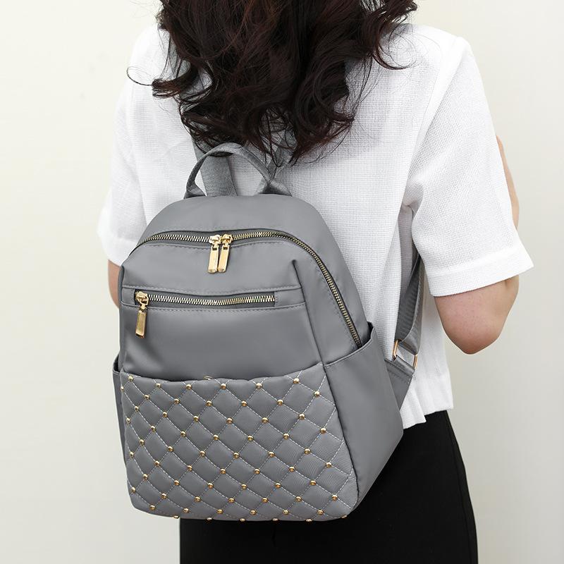 

New diamond sewing line rivets fashion backpack women s texture Korean version large capacity simple women s backpack серый