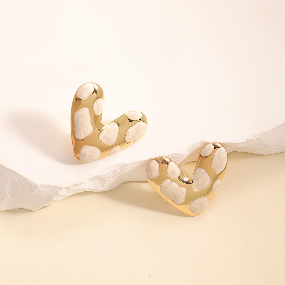 Japan and Korea simple design love stud earrings niche versatile hollow earrings stainless steel dripping oil cold wind women's earrings