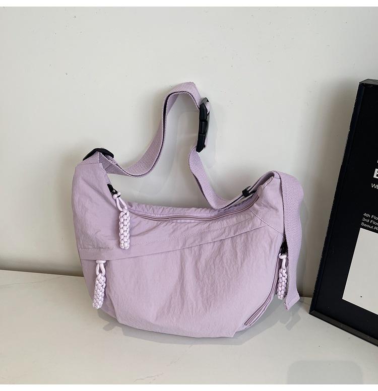 

Crossbody bag female Korean large-capacity versatile lightweight literary dumpling bag leisure sports shoulder bag student class bag фиолетовый