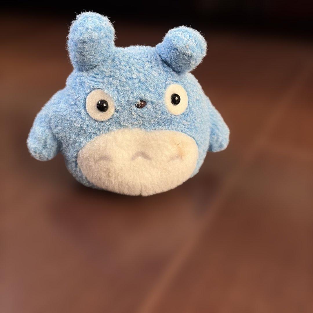 Totoro style blue stuffed animal with tag