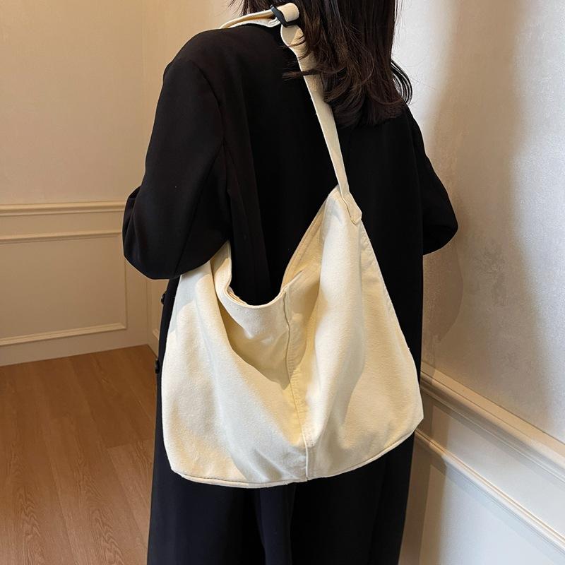 Bag women's new bag high-end canvas dumplings fashionable large-capacity shoulder messenger bag
