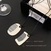 Fashion sense small comb titanium steel black rope pendant necklace women's high-end sweater chain long sweater chain accessories