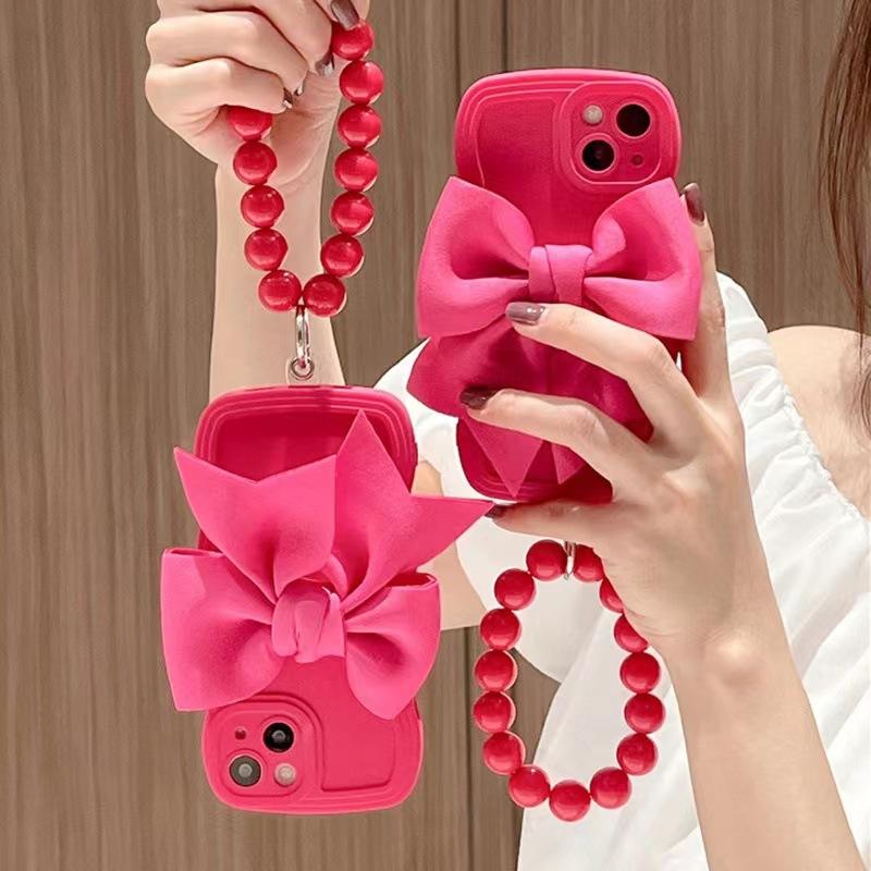 Rose red bow wristband is suitable for Apple 14 mobile phone case, new iPhone13promax women's 12 three-dimensional 11.