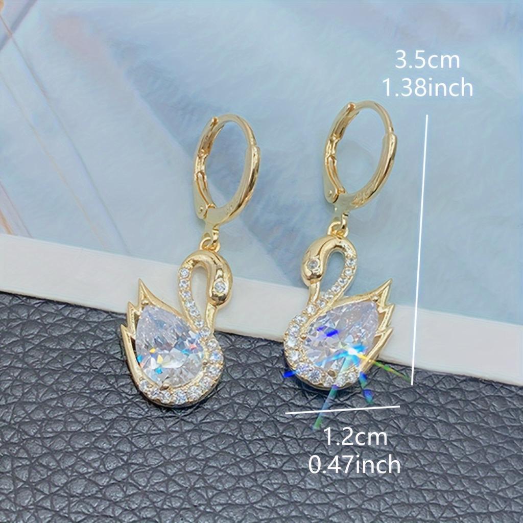 1 Pair of Luxurious Golden-Tone Swan Dangle Earrings with Sparkling Rhinestones - Elegant Zinc Alloy Fashion Jewelry for Women