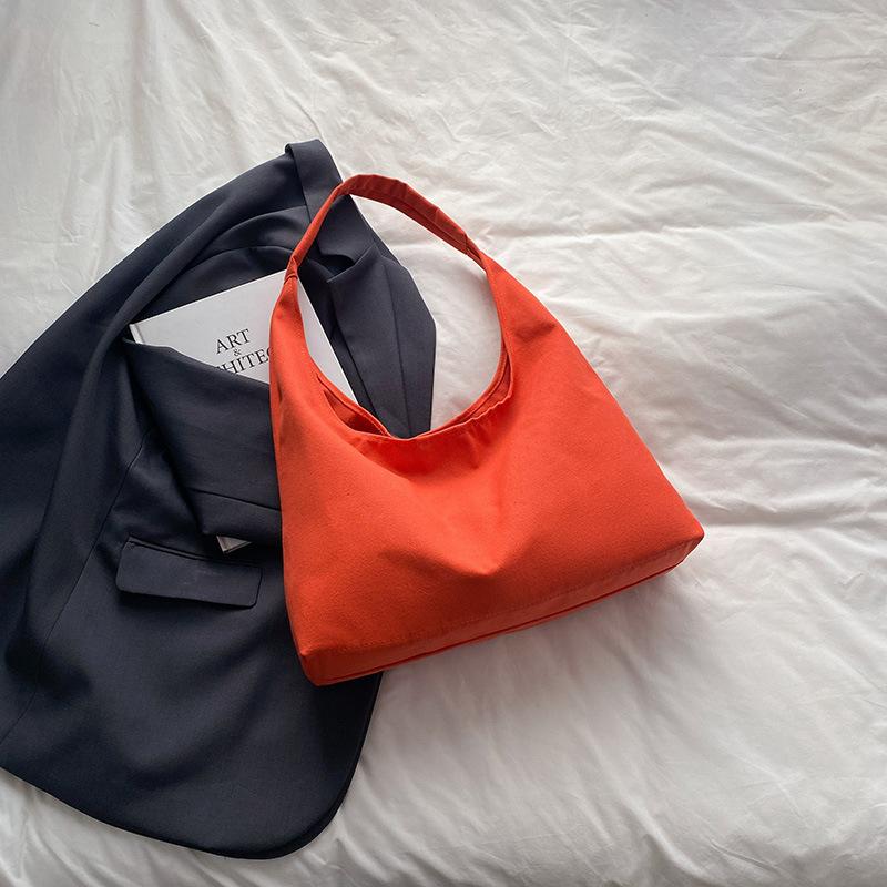 

Сумка-тоут под мышкой женская сумка 2025 новая летняя персонализированная корейская версия красивая большая вместимость однотонная на плечо сумка для покупок сумка оранжевый