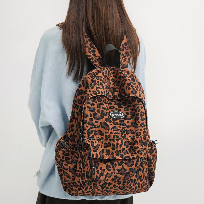 SchoolbagYX high-value leopard print backpack female college student daily commuter backpack high school junior high school large-capacity schoolbag