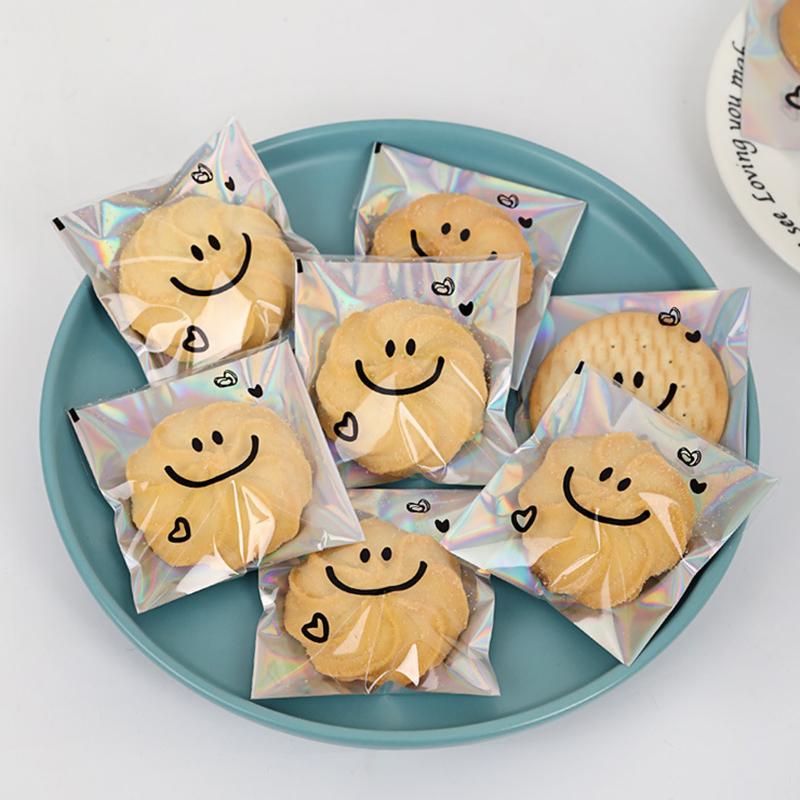 100pcs Cute Smiling Face Self-adhesive Bag Laser Transparent Biscuit Bag Cookie Packaging Bags Birthday Party Baby Shower