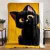 A black kitten with large yellow eyes sits against a bright yellow background. for all seasons blanket lunch break throw gift