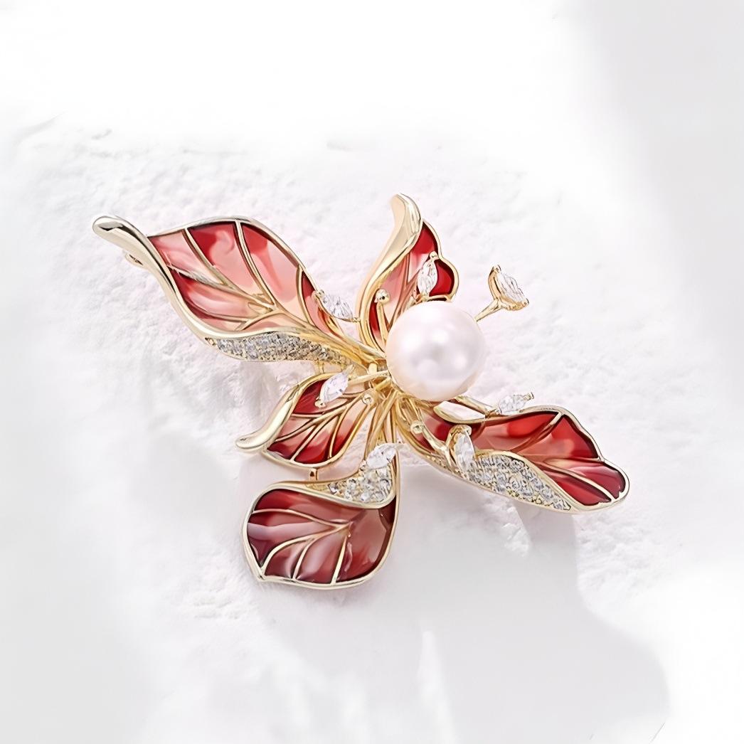 

Брошь «Ирис» — это универсальная и элегантная жемчужная брошь с дизайном «легкая роскошь». красный