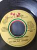 Disque 7 pouces RAS ENIE, LUCIANO - Protect The Children NONE Rhino Cobre Rec Jamaïque Reggae, Ska & Dub Occasion