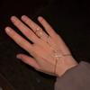 1-piece fringe bracelet-ring combo: a lightweight, luxurious ring-bracelet hybrid for hand adornment, featuring a niche.