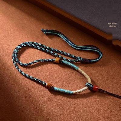 Handwoven Tibetan-style Cotton Rope Lanyard Necklace with Amber Antique Buddhist Amulet Pendant