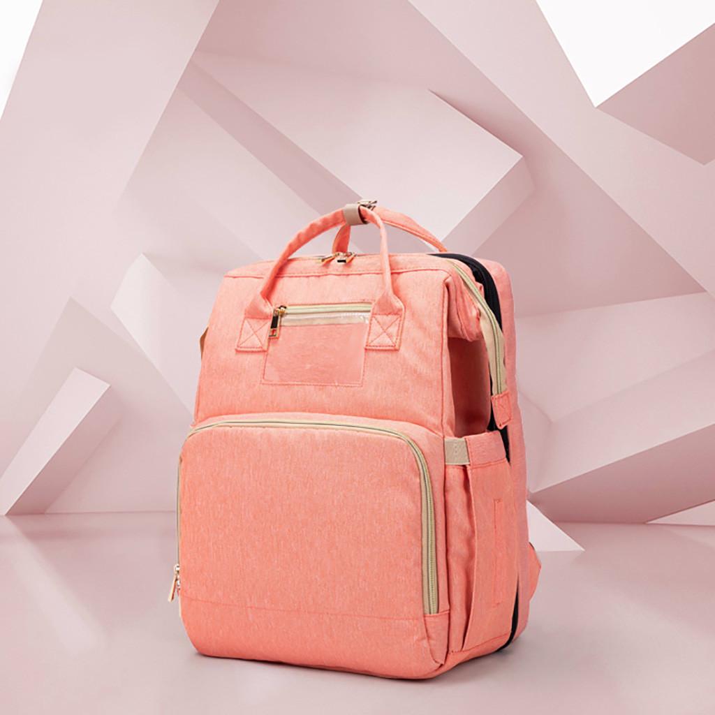 travel mommy bag and crib