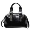 Today's popular women's bags, new simple rivets, large-capacity hand-held versatile shoulder pillow bag