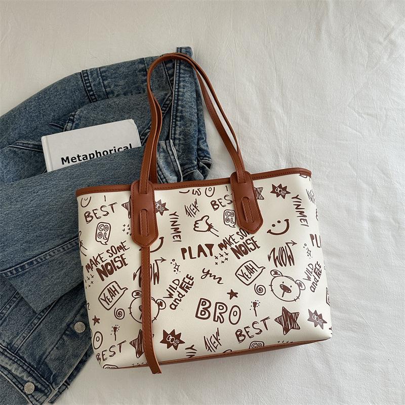 Einfache Temperament große Kapazität Tragetasche Damen 2025 Sommer neu kleine frische Druck Schulter Computertasche