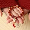 1pc Women's Stackable Red Agate Beaded Bracelet with Lucky Four-Leaf Clover Plum Blossom Pendant, Golden Tassel