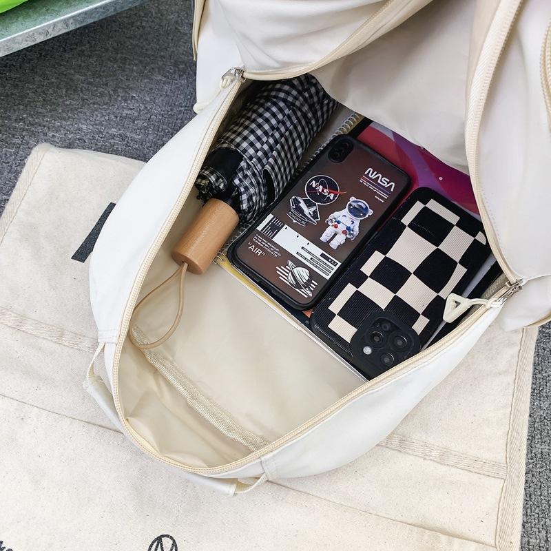 Nya trendiga skolväskor för mellanstadieelever Stor kapacitet Fritidsväskor för utomhusbruk för män och kvinnor Enkla trendiga och coola ryggsäckar