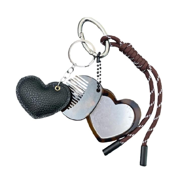 

Sturdy Plastic Alloy Rope Keychain With Builts In Comb Mirror for Portable Storage and Personalize Care Daily Use