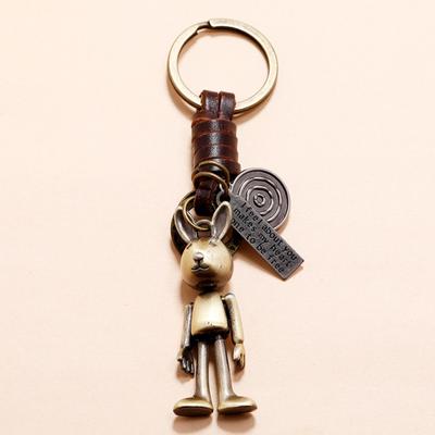 Porte-clés en cuir de vachette tissé rétro avec mains et pieds mobiles, petit cadeau