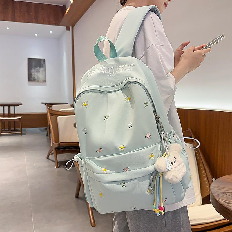 Design sense dopamine embroidery large capacity junior high school bag ins niche female high school student lightweight backpack