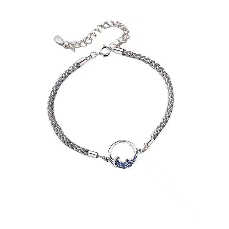 A stylish woven moon pendant bracelet, a couple's jewelry piece suitable for everyday wear by couples.